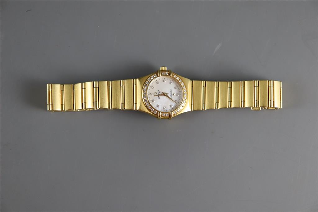 A ladys 1990s 18ct gold Omega Constellation quartz wrist watch with diamond set mother of pearl dial and bezel,